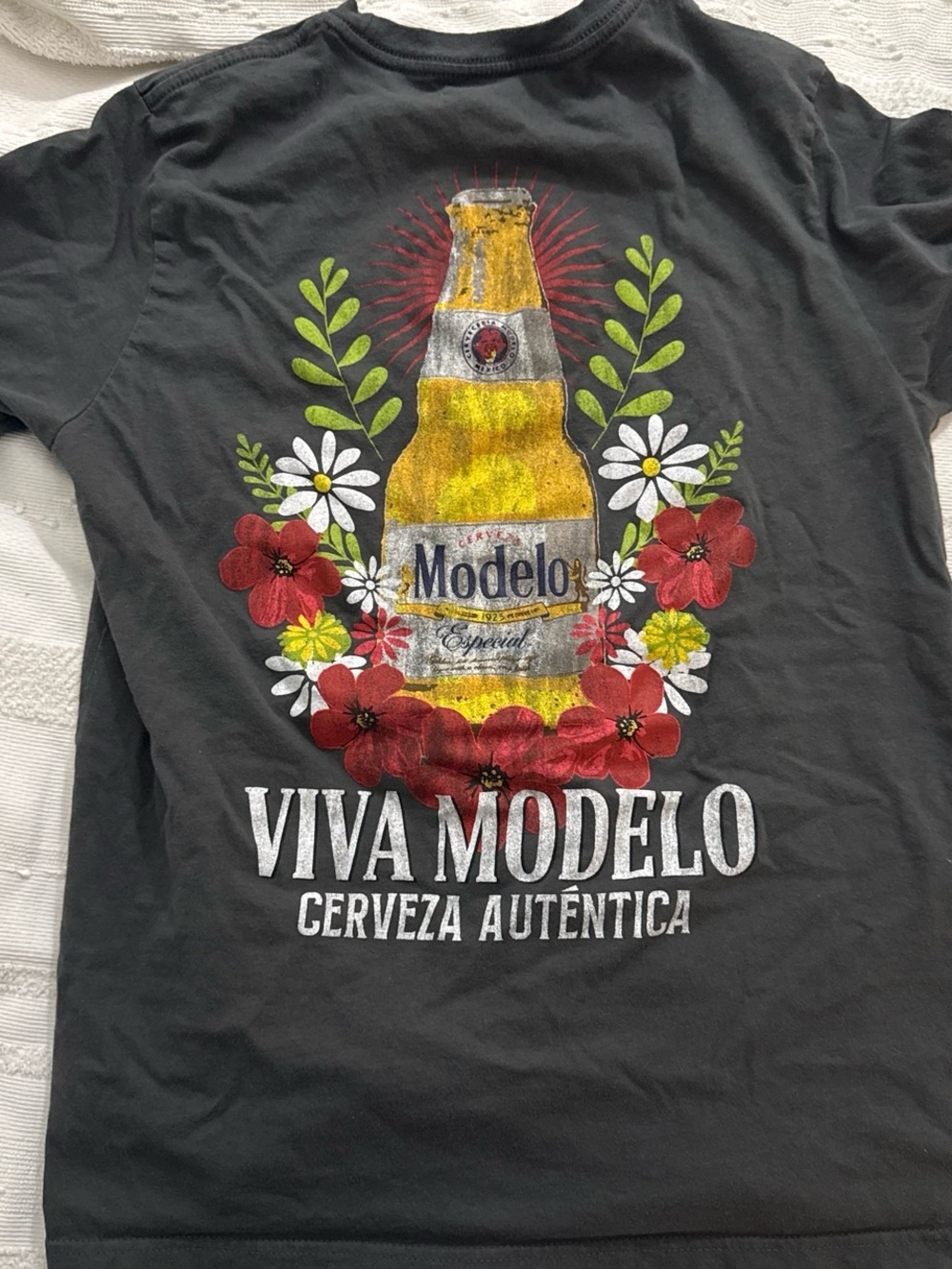 ModelCo Black Tee with Yellow Bottle and Red Floral Graphic
